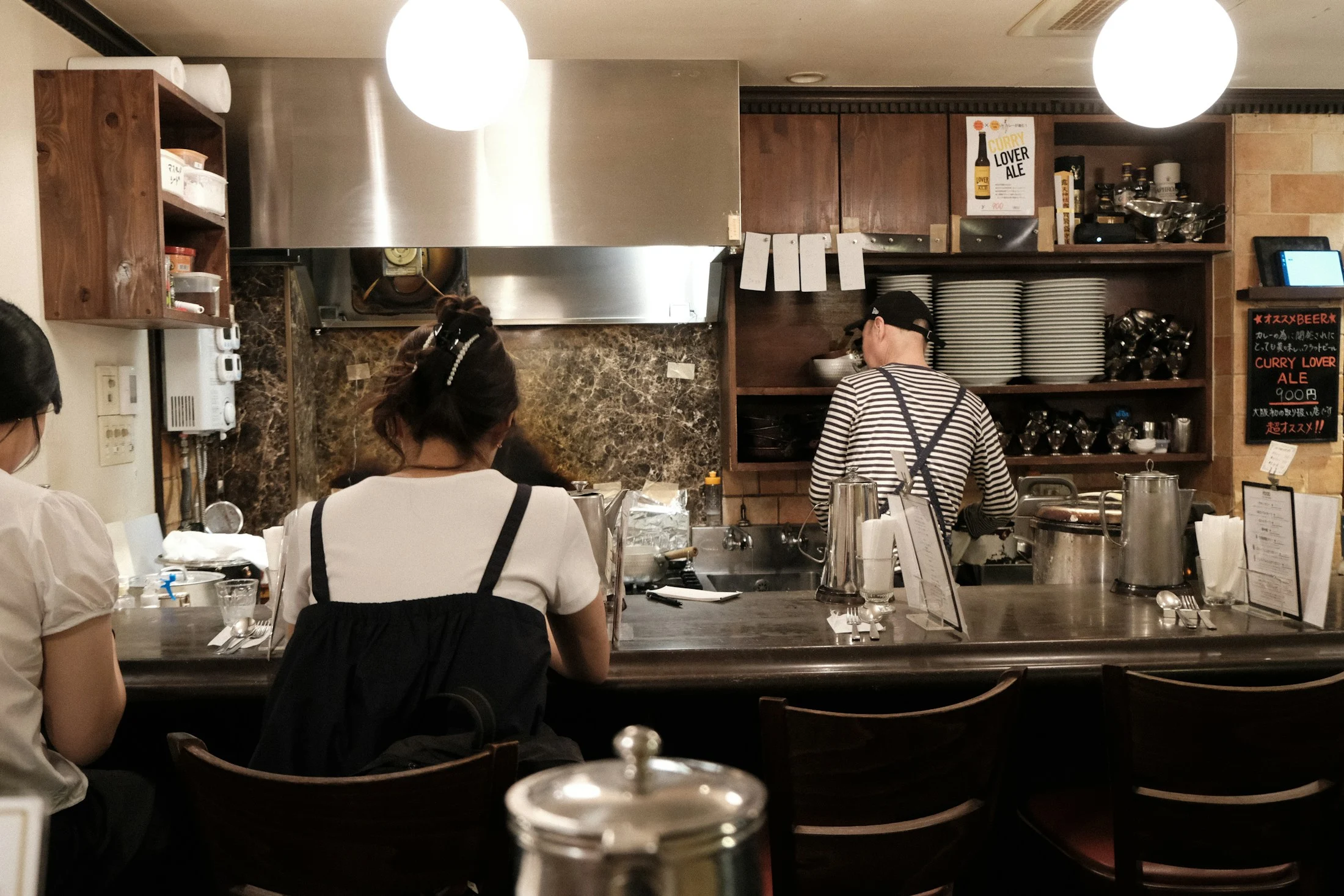 A café workspace with staff behind the counter