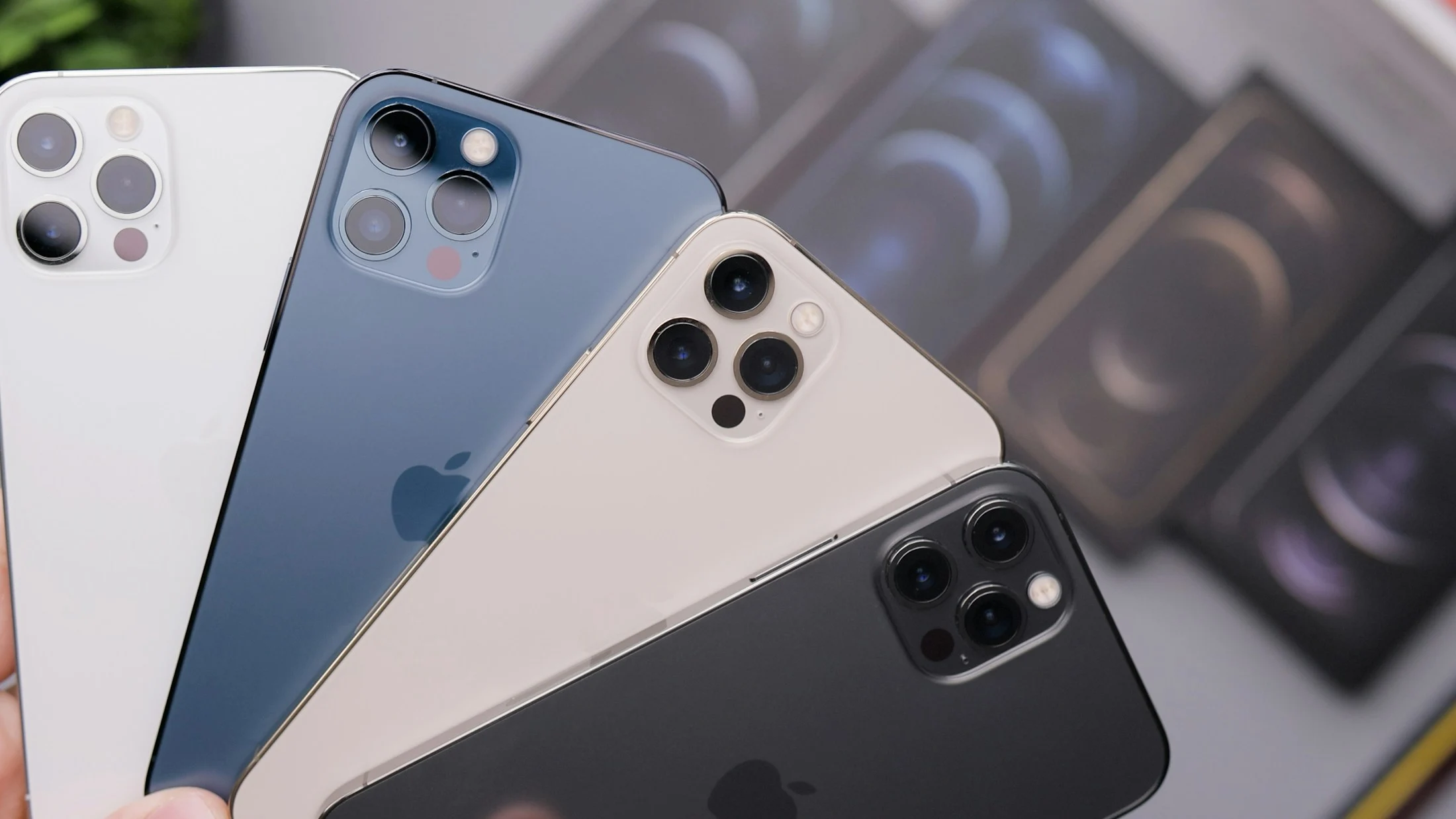 Three smartphones showing their rear cameras